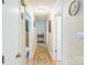 Hallway featuring hardwood floors, neutral walls, and doors leading to multiple rooms at 814 Rhodann Dr, Shelby, NC 28152