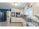 Cozy kitchen with white cabinetry, granite countertops, and stainless steel appliances at 814 Rhodann Dr, Shelby, NC 28152