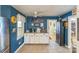 Charming kitchen features white cabinets, a ceiling fan, and a connected dining area at 814 Rhodann Dr, Shelby, NC 28152