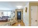 Living room features include a comfortable chair, wood flooring and an exterior entry door at 814 Rhodann Dr, Shelby, NC 28152