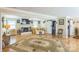 Living room area showcases a fireplace, comfortable seating, and access to other rooms at 814 Rhodann Dr, Shelby, NC 28152