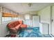 Bright sunroom with ample seating and a white refrigerator at 814 Rhodann Dr, Shelby, NC 28152