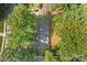 Aerial shot of a property with mature trees, lush landscaping, and well-manicured lawn at 844 Fieldstone Rd, Mooresville, NC 28115