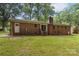 Exterior shot of a red brick house with a grassy backyard at 844 Fieldstone Rd, Mooresville, NC 28115