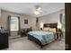 Cozy bedroom features a ceiling fan and large windows for natural light at 844 Fieldstone Rd, Mooresville, NC 28115