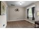 Versatile empty room with hardwood floors, neutral walls, and ample natural light, ready for personalization at 844 Fieldstone Rd, Mooresville, NC 28115