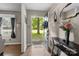 Bright entryway featuring hardwood floors, stylish decor, and a welcoming atmosphere with a view of the front yard at 844 Fieldstone Rd, Mooresville, NC 28115