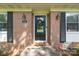Charming front door with wreath and dark shutters, creating a warm and inviting entryway at 844 Fieldstone Rd, Mooresville, NC 28115