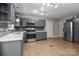 Spacious kitchen includes stainless steel appliances and ample countertop space at 844 Fieldstone Rd, Mooresville, NC 28115