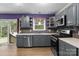 This lovely kitchen boasts stainless appliances and gray cabinets at 844 Fieldstone Rd, Mooresville, NC 28115