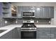 The kitchen includes stainless steel appliances and quartz countertops at 844 Fieldstone Rd, Mooresville, NC 28115