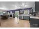 This area includes a dining room with a fireplace, and kitchen at 844 Fieldstone Rd, Mooresville, NC 28115