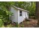 White storage shed provides ample outdoor storage space at 844 Fieldstone Rd, Mooresville, NC 28115