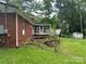 Exterior view of a screened in porch with a wooden deck at 8524 Anette Ave, Mint Hill, NC 28227