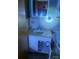Small bathroom with a pedestal sink and a cabinet door open to storage under the sink at 8524 Anette Ave, Mint Hill, NC 28227