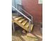 Newly built deck stairs leading to a red brick building, complementing the exterior aesthetic at 8524 Anette Ave, Mint Hill, NC 28227