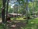 Exterior view of the home surrounded by tall trees at 8524 Anette Ave, Mint Hill, NC 28227