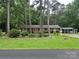 Charming brick home with a lush front yard and mature trees at 8524 Anette Ave, Mint Hill, NC 28227