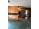 Kitchen that opens to another living space and features wood cabinets and stainless steel appliances at 8524 Anette Ave, Mint Hill, NC 28227