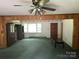 Spacious living room with vintage wallpaper, featuring a large window for natural light at 8524 Anette Ave, Mint Hill, NC 28227