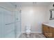 Bathroom with a glass shower, toilet, and wood vanity at 8540 Indian Summer Trl, Harrisburg, NC 28075