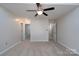 Spacious bedroom with a ceiling fan and carpet at 8540 Indian Summer Trl, Harrisburg, NC 28075
