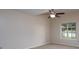Spacious bedroom with a ceiling fan and a window at 8540 Indian Summer Trl, Harrisburg, NC 28075
