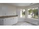 Bright breakfast nook features natural light, updated flooring, and ample cabinet space at 8540 Indian Summer Trl, Harrisburg, NC 28075