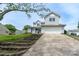Charming two-story home with a two-car garage, terraced steps to the front door, and lawn at 8540 Indian Summer Trl, Harrisburg, NC 28075