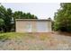 Small storage garage with gravel area at 8540 Indian Summer Trl, Harrisburg, NC 28075