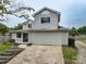 Two-story home featuring a two-car garage, terraced steps to the front door, and lawn at 8540 Indian Summer Trl, Harrisburg, NC 28075