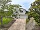 Charming two-story home with a two-car garage, terraced steps to the front door, and lawn at 8540 Indian Summer Trl, Harrisburg, NC 28075