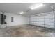 Spacious two car garage with white walls and concrete floors at 8540 Indian Summer Trl, Harrisburg, NC 28075