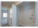 A convenient laundry area adjacent to the powder room at 8540 Indian Summer Trl, Harrisburg, NC 28075