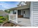 View of porch with white railing and grey painted floor at 8540 Indian Summer Trl, Harrisburg, NC 28075