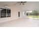 Enclosed sunroom with vaulted ceilings, ceiling fan, and lots of windows overlooking the backyard at 8540 Indian Summer Trl, Harrisburg, NC 28075