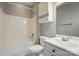 Full bathroom featuring a shower-tub combo, single sink vanity, and toilet at 8731 Coralbell Ln, Charlotte, NC 28213