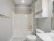 Bathroom featuring a shower-tub combo, single sink vanity, and tile floor at 8731 Coralbell Ln, Charlotte, NC 28213