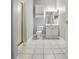 This bathroom features a glass shower, tiled floors, and a white vanity at 8731 Coralbell Ln, Charlotte, NC 28213