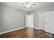 This room has vinyl floors, white trim, a ceiling fan and neutral walls at 8731 Coralbell Ln, Charlotte, NC 28213