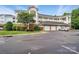Multi-story condo building featuring brick accents, multiple balconies and attached garages at 8731 Coralbell Ln, Charlotte, NC 28213