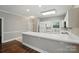 Bright kitchen featuring white appliances, ample counter space, and modern lighting at 8731 Coralbell Ln, Charlotte, NC 28213