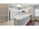 Functional kitchen with white appliances, ample counter space, and convenient layout at 8731 Coralbell Ln, Charlotte, NC 28213