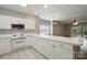 Bright, open kitchen with white cabinets and appliances, perfect for modern living at 8731 Coralbell Ln, Charlotte, NC 28213
