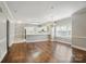 Inviting living room with hardwood floors and an open floor plan to the kitchen area at 8731 Coralbell Ln, Charlotte, NC 28213