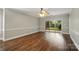 Spacious living room with a ceiling fan and a sliding glass door leading to outdoor space at 8731 Coralbell Ln, Charlotte, NC 28213