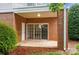 This outdoor patio has brick siding and a glass sliding door at 8731 Coralbell Ln, Charlotte, NC 28213