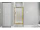 Shower includes a gold frame and tiling at 8731 Coralbell Ln, Charlotte, NC 28213