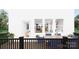 Back porch with a table set for dining overlooking views into the home's kitchen, dining and living spaces at 917 Archway Ln, Charlotte, NC 28217