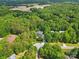 Expansive aerial view of the home nestled among lush greenery and mature trees at 9918 Windrow Dr, Indian Trail, NC 28079